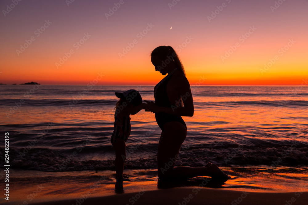 Mother and daughter at the sea 