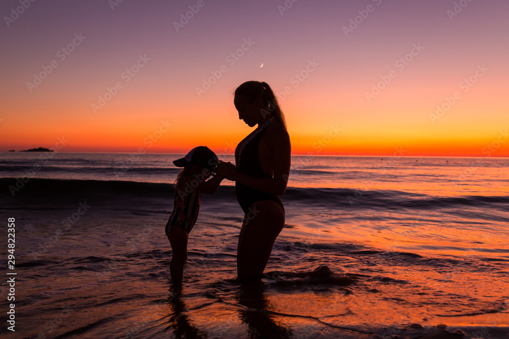 Mother and daughter at the sea 