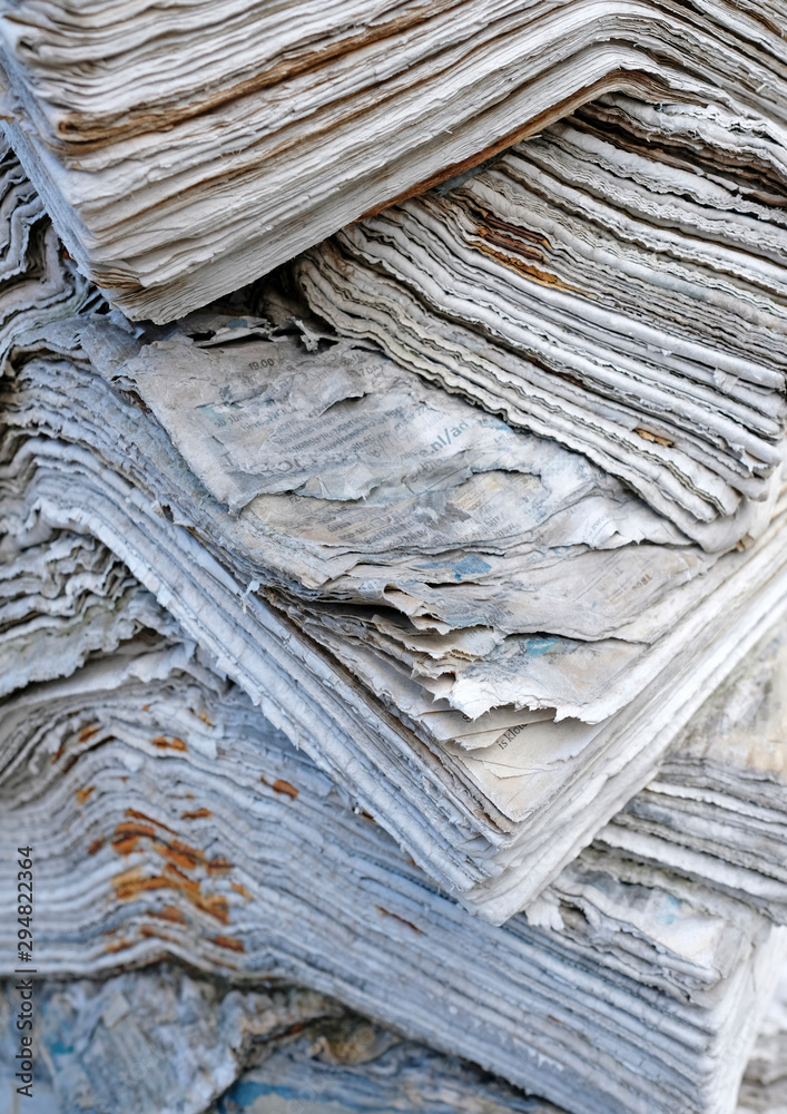 Fototapeta premium Pile of weathered old books ad newspapers