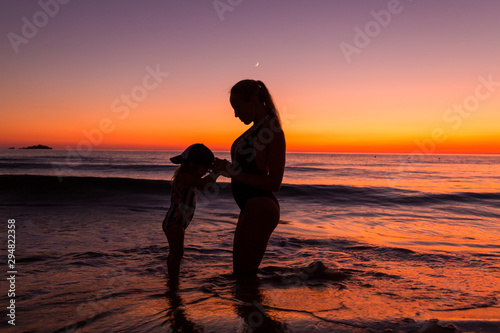 Mother and daughter at the sea  © antonburkhan