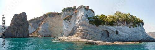 Panoramic view of the rock and the rocky cliff (Faraglioni della Madonna and the Grotte di Pilato) of the island of Ponza in central Italy. Panorama of a beautiful island.