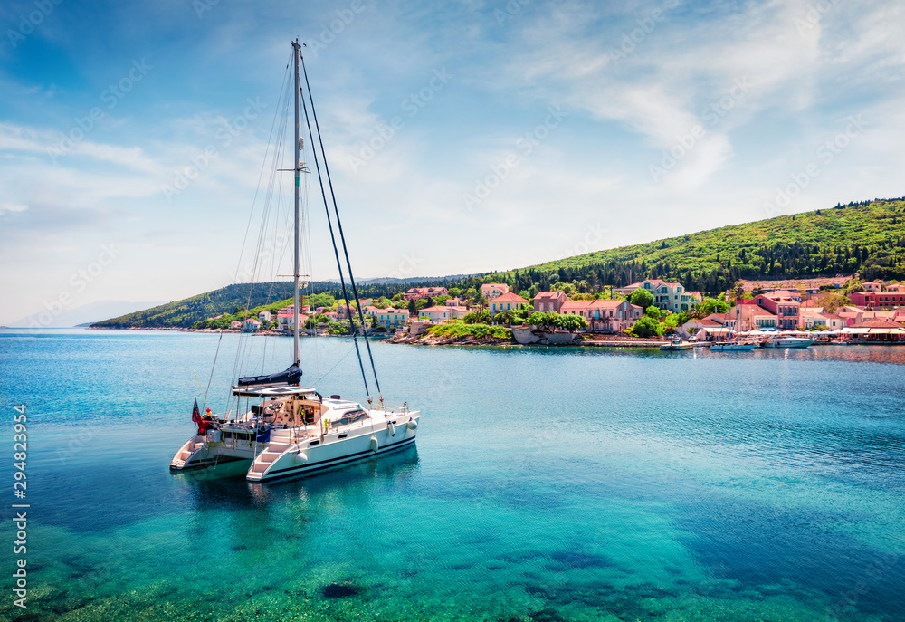 Romantic morning view of Fiskardo port. Spectacular spring seascape of Ionian Sea. Colorful morning scene of Kefalonia island, Greece, Europe. Traveling concept background.