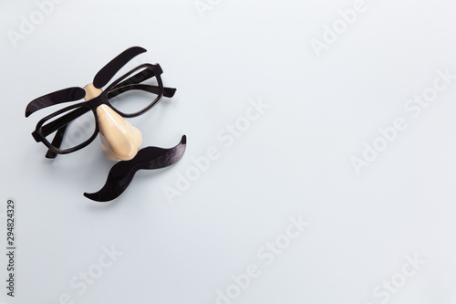 Wallpaper Mural Carnival mask with moustache, nose and glasses on grey background, copy space. Concept Movember, men's health, prostate cancer awareness month, charity, Father's Day. Horizontal. Minimalism flat lay Torontodigital.ca