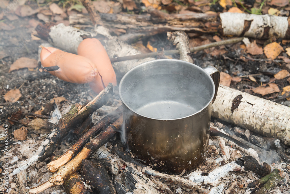 cooking in the woods in camp conditions on a fire cooking in the woods in camp conditions on a fire