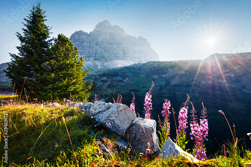 Amazing morning view of western slope of Tre Cime di Lavaredo mpountain peaks. Colorful summer scene of Dolomiti Alps, South Tyrol, Italy, Europe. Beauty of nature concept background. photo