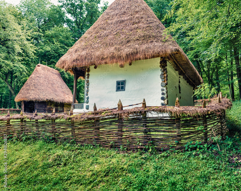 Captivating summer view of traditional romanian peasant houses. Nice rural scene of Transylvania, Romania, Europe. Beauty of countryside concept background. Captivating summer view of traditional romanian peasant houses. Nice rural scene of Transylvania, Romania, Europe. Beauty of countryside concept background.