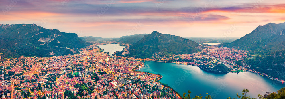 Panoramic summer scene of Como lake. Aerial evening cityscape of Lecco town with Resegone mount on background,  Italy, Europe. Traveling concept background. - obrazy, fototapety, plakaty 