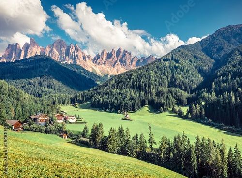 Splendid morning view of St. Magdalena village. Sunny summer scene of Funes Valley (Villnob) with Odle Group mountains on background, Dolomiti Alps, Bolzano, South Tyrol, Italy.