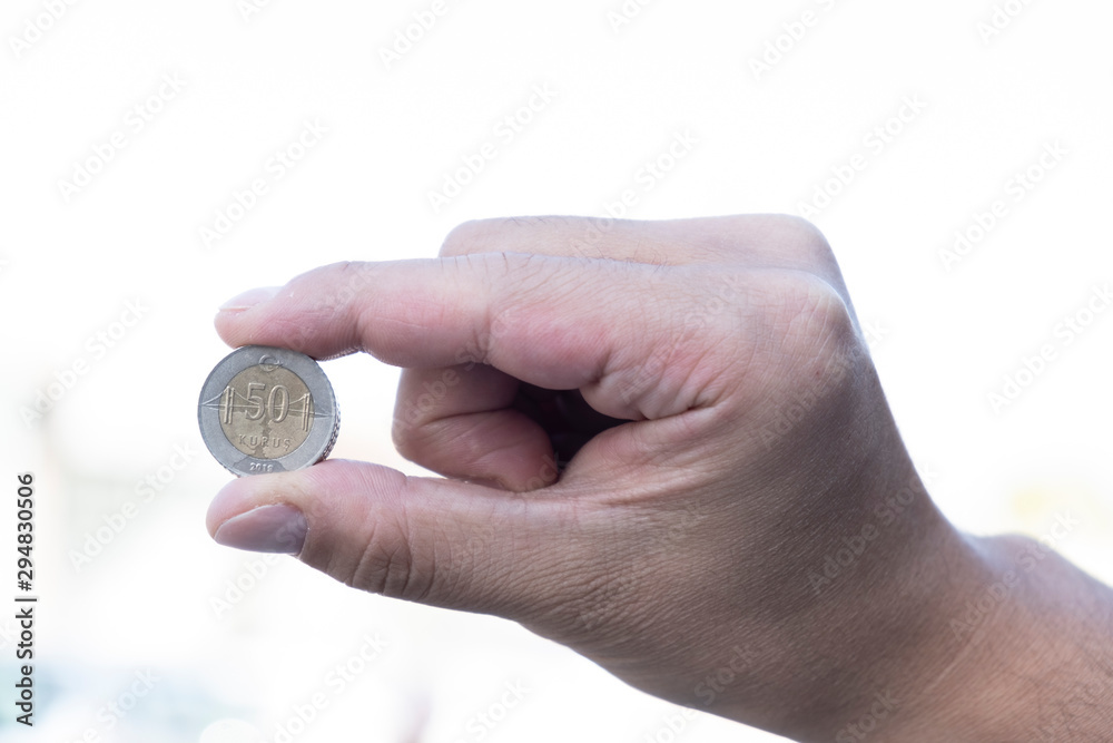 Turkish coin on hand , man holding turkish lira Turkish coin on hand , man holding turkish lira