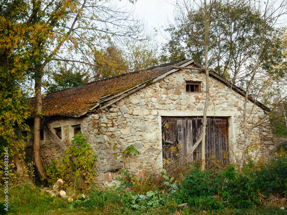 Old stone building among the trees. Autumn mood Old stone building among the trees. Autumn mood