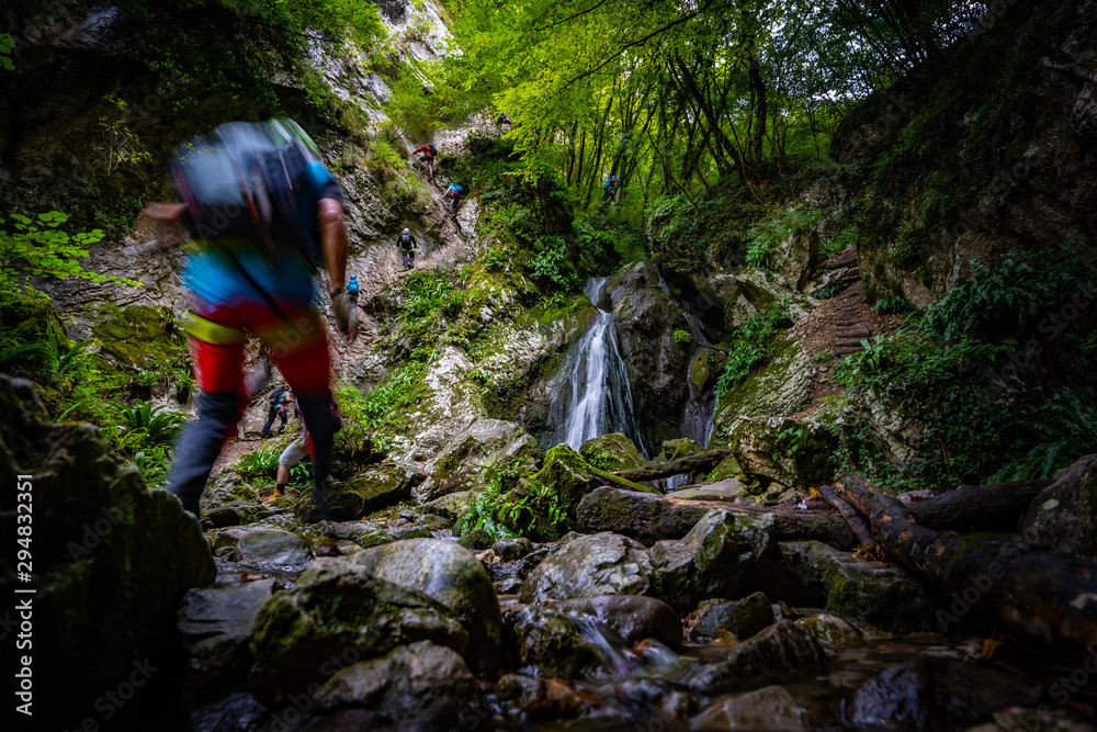 Waterfall and blurry man