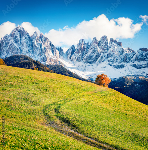 Impressive view of Santa Magdalena village hills in front of the Geisler or Odle Dolomites Group. Colorful autumn scene of Dolomite Alps, Italy, Europe. Beauty of countryside concept background.