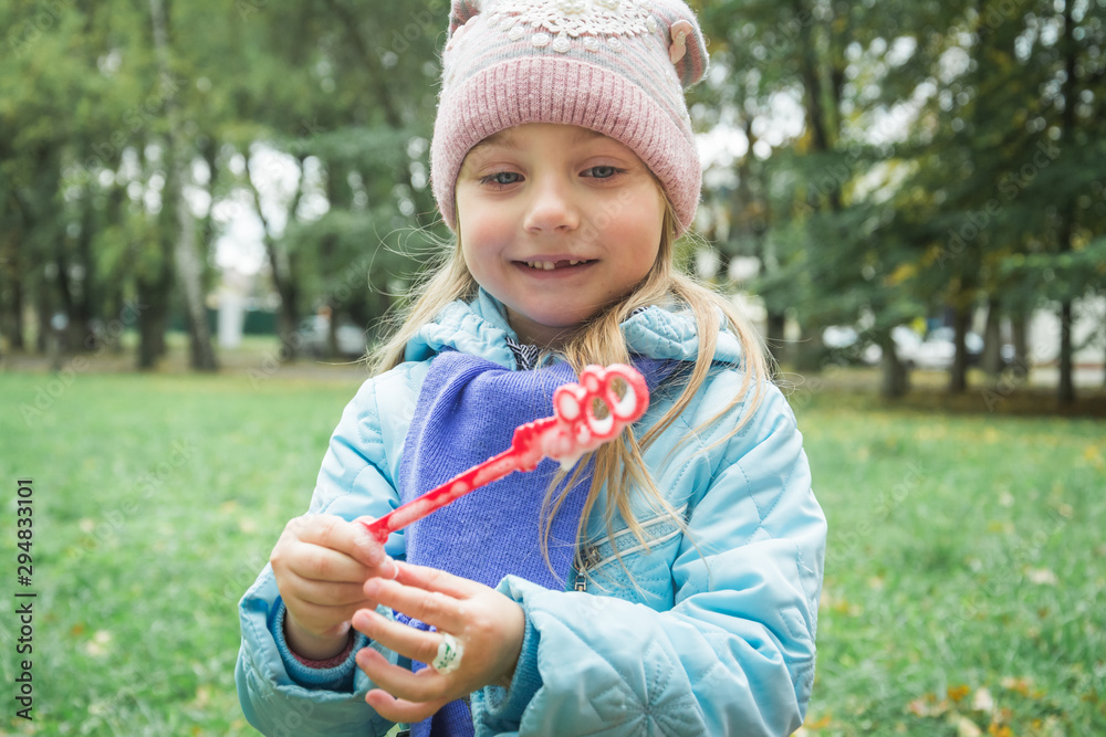A little girl blowing soap bubbles. A little girl blowing soap bubbles.