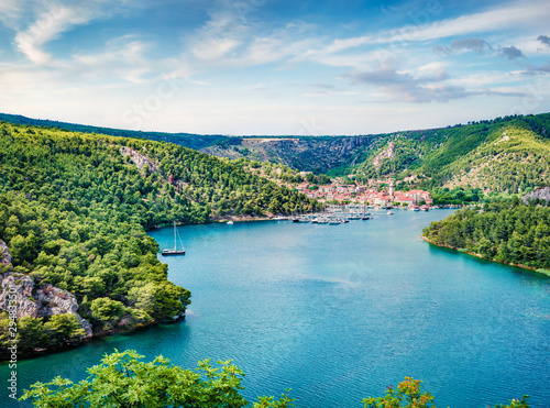 Wonderful spring cityscape of Skradin port. Aerial morning vire of Krka National Park, Prokljansko lake, Croatia, Europe. Beautiful world of Mediterranean countries. Traveling concept background. photo