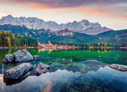 Picturesque morning scene of Eibsee lake with Zugspitze mountain range on background. Sunny autumn view of Bavarian Alps  Germany  Europe. Beauty of nature concept background.