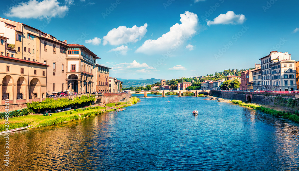 Splendid morning scene with Ponte alle Grazie bridge over Arno river. Colorful spring view of Florence, Italy, Europe. Traveling concept background.