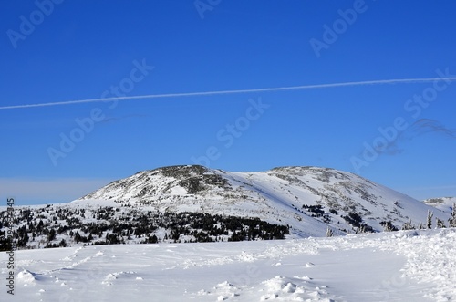 Winter landscape in the mountains, clean air, blue sky, relaxation for body and soul.