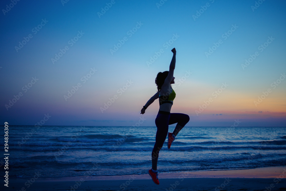 healthy sports woman on seashore in evening training healthy sports woman on seashore in evening training