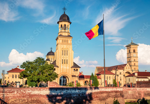 Gorgeous morning view of bell tower of Reunification Cathedral, Fortified churches inside Alba Carolina Fortress. Splendid summer scene of Transylvania, Alba Iulia city, Romania, Europe.