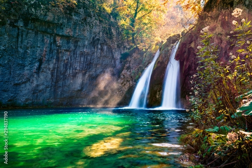 Perfect morning view of pure water waterfall in Plitvice National Park. Stunning autumn scene of Croatia, Europe. Abandoned places of Plitvice lakes series. Beauty of nature concept background.