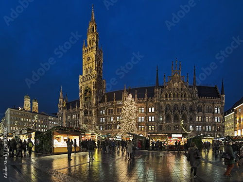 Munich, Germany. Panoramic view of the city's main Christmas market on the Marienplatz square in front of the New Town Hall in twilight.