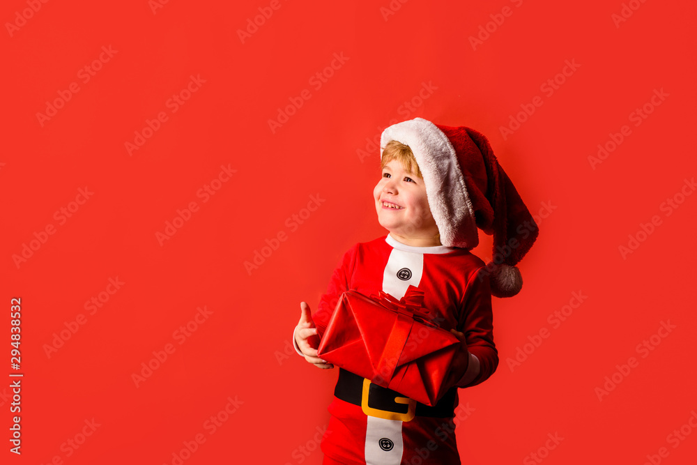Christmas children. Little kids celebrating Christmas. Child with Christmas present. Happy child in Santa costume. Little Santa Claus gifting gift. Cute boy in santa hat. New year kid. Happy new year. Christmas children. Little kids celebrating Christmas. Child with Christmas present. Happy child in Santa costume. Little Santa Claus gifting gift. Cute boy in santa hat. New year kid. Happy new year.