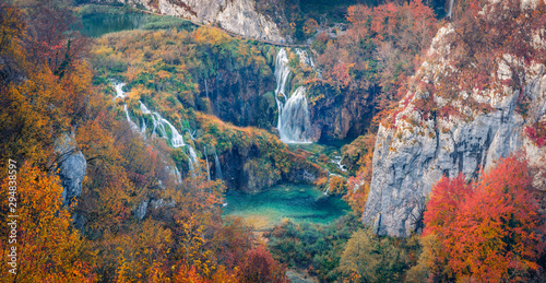 Panoramic morning view of pure water waterfall in dyyp canyon. Awesome autumn scene of Plitvice National Park, Croatia, Europe. Beauty of nature concept background. © Andrew Mayovskyy