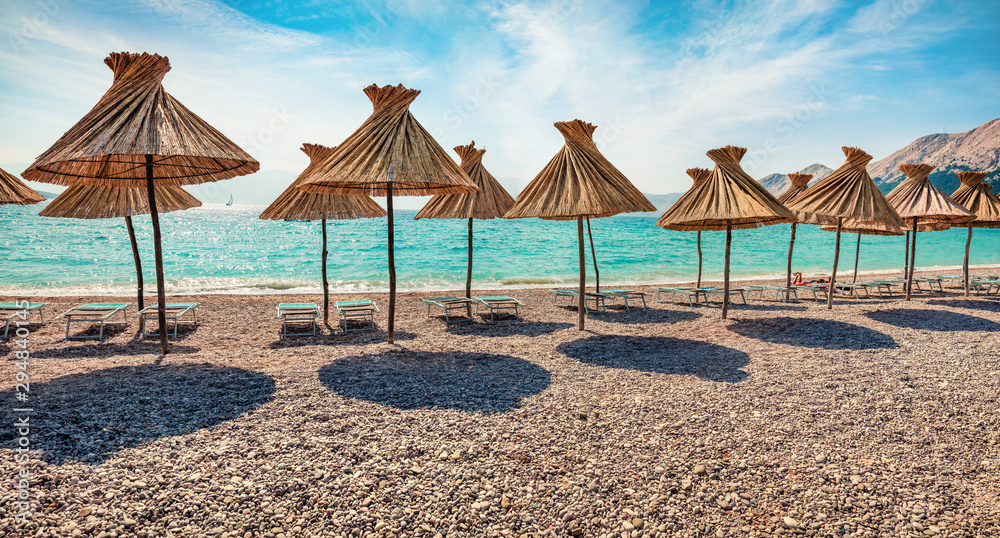 Fototapeta premium Panoramic morning view of Baska Beach. Bright summer seascape of Adriatic sea, Baska town location, Krk island, Kvarner bay archipelago, Croatia, Europe. Beautiful world of Mediterranean countries.