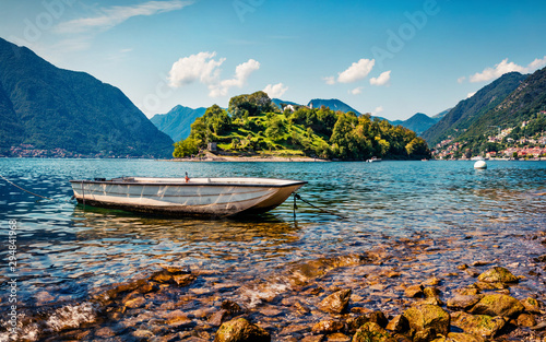 Great sunny day on Como lake. Picturesque morning landscape of Comocina island from the hiil of Ossuccio village, Province of Como, region Lombardy, Italy, Europe. Traveling concept background. photo