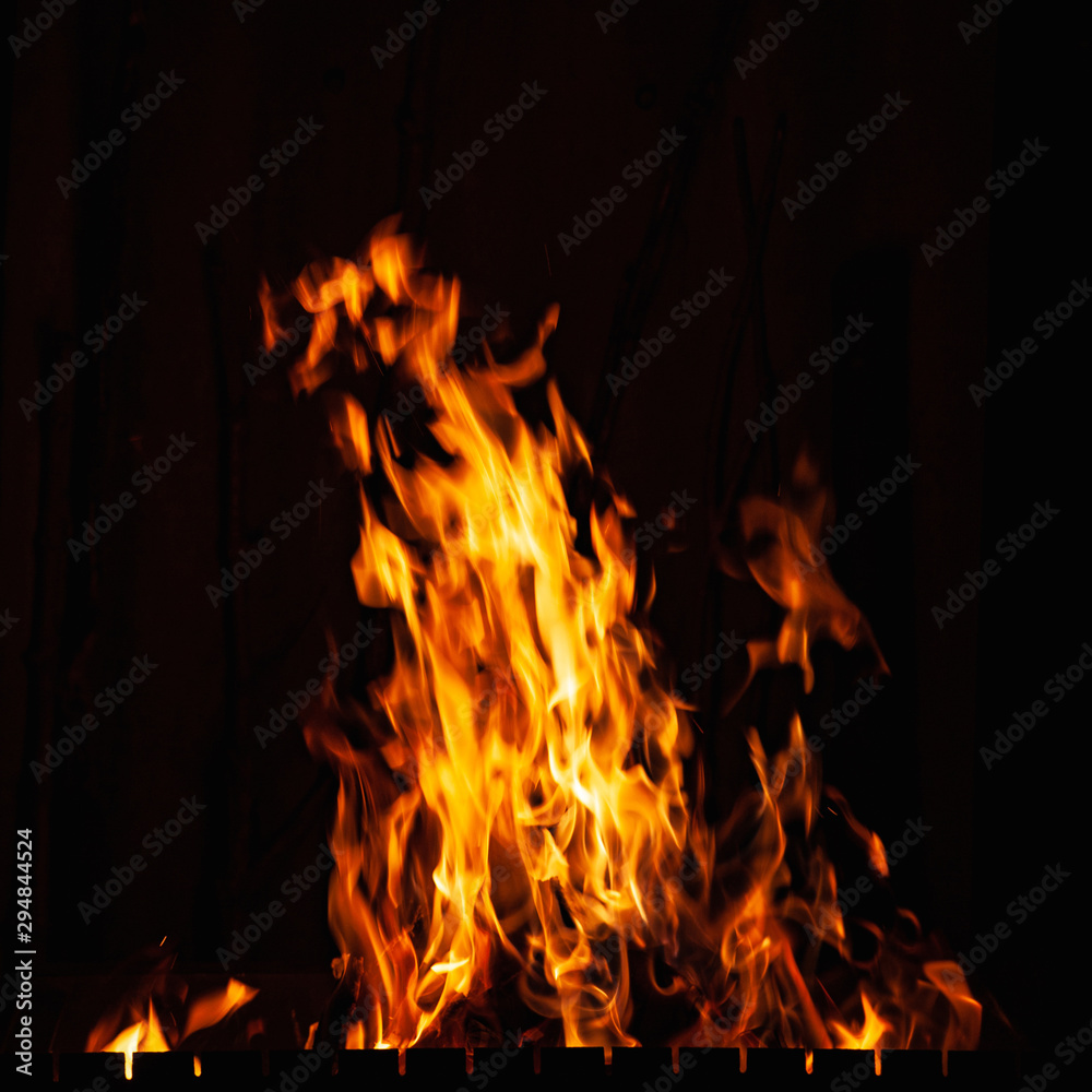 Fire flame. Burning fire at night. Bonfire in the barbecue, fireplace and hearth. Fire flame. Burning fire at night. Bonfire in the barbecue, fireplace and hearth.