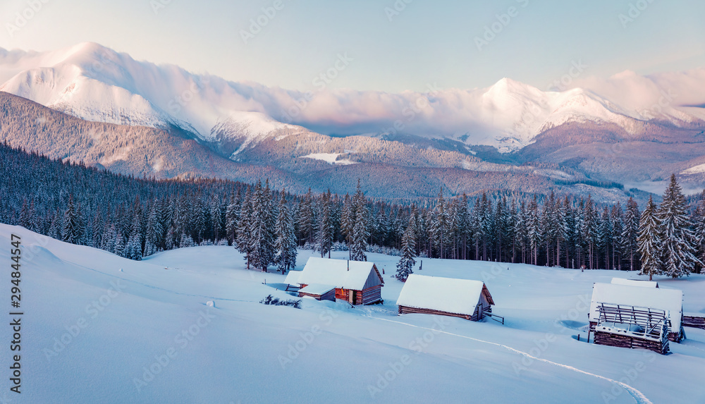 Frosty winter sunrise in Carpathian mountains with snow covered fir trees. Splendid outdoor panorama, Happy New Year celebration concept. Frosty winter sunrise in Carpathian mountains with snow covered fir trees. Splendid outdoor panorama, Happy New Year celebration concept.