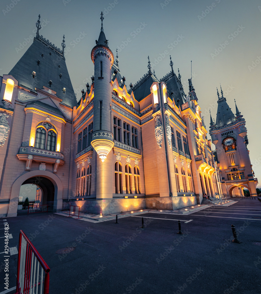 Fototapeta premium Wonderful night view of Cultural Palace Iasi. Great summer cityscape of Iasi town, capital of Moldavia region, Romania, Europe. Architecture traveling background.