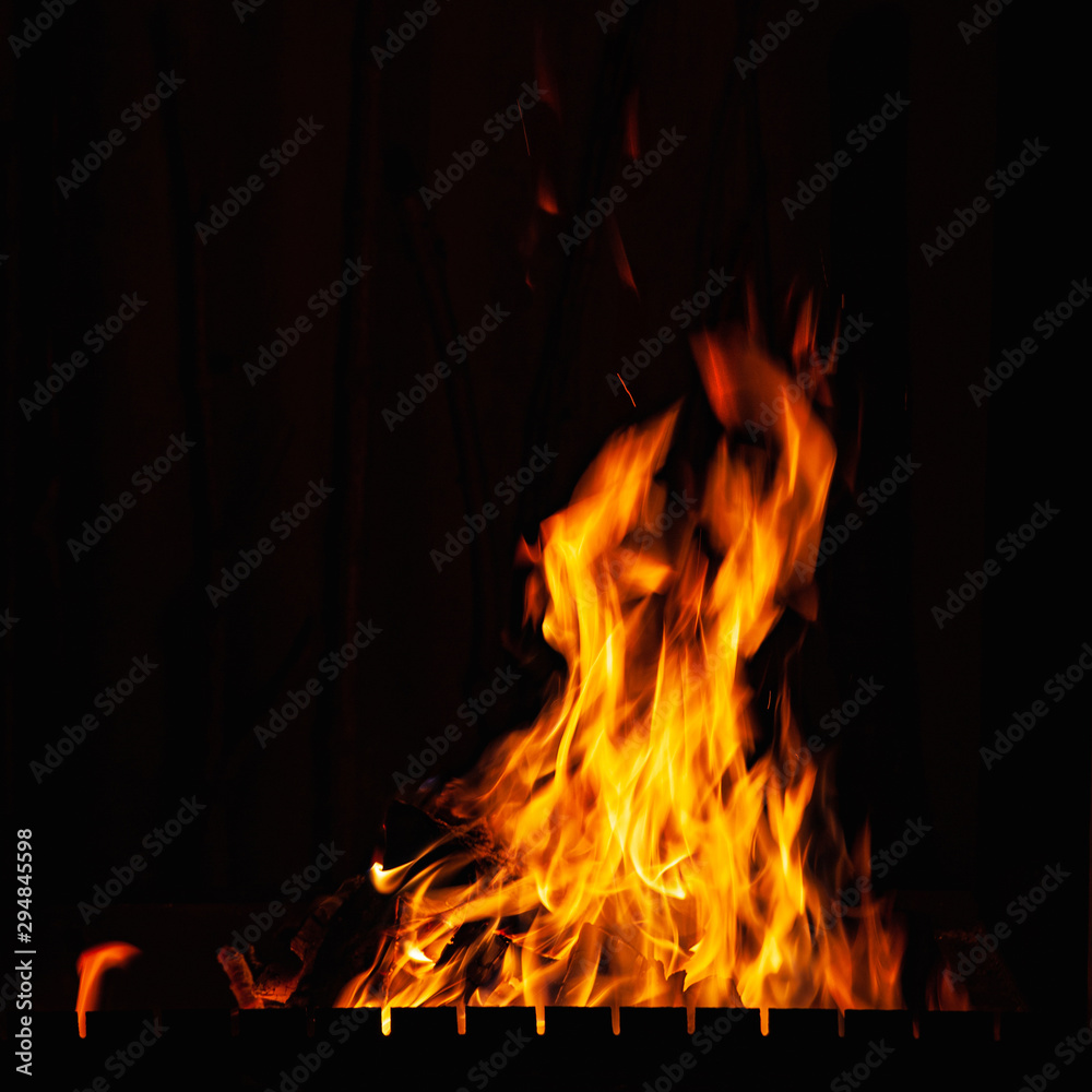 Flames. Of fire burning at night. Bonfire in the barbecue, fireplace and hearth. Flames. Of fire burning at night. Bonfire in the barbecue, fireplace and hearth.