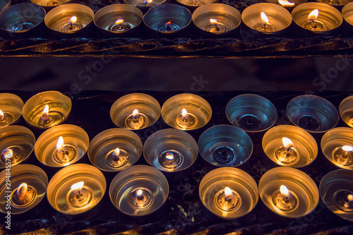 Prayer candles inside the Vilnius Cathedral. Interior of Neo-classical Vilnius Cathedral (Basilica of St Stanislaus and St Ladislaus, 1783). Selective focus