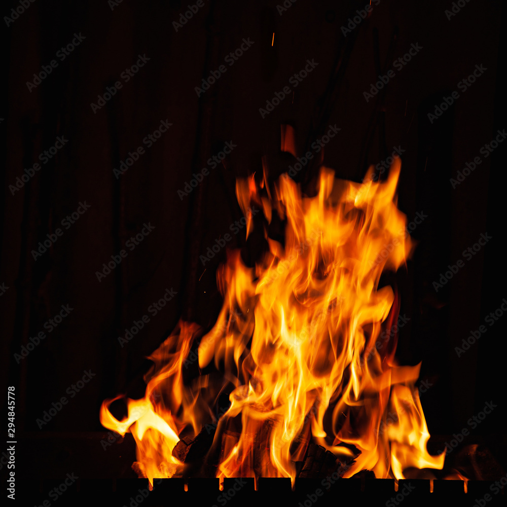 Fire flame. Bonfire in the barbecue, fireplace and a hot home. Burning fire at night. Fire flame. Bonfire in the barbecue, fireplace and a hot home. Burning fire at night.