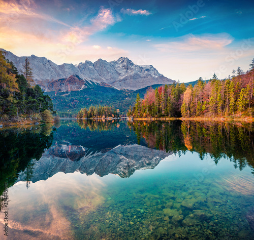 Colorful morning scene of Eibsee lake with Zugspitze mountain range on background. Amazing autumn view of Bavarian Alps  Germany  Europe. Beauty of nature concept background.