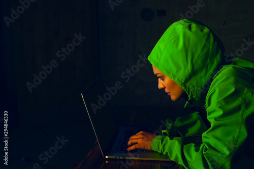 Young Female Hacker Breaks into Corporate Data Servers from His Underground Hideout. Place Has Dark Atmosphere - Image