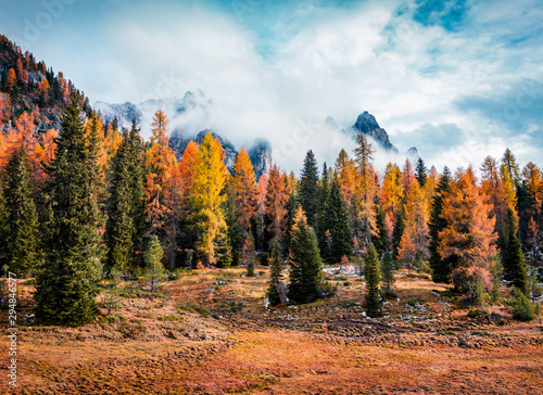 Majestic morning view of National Park Tre Cime di Lavaredo. Gorgeous autumn scene of Dolomite Alps, South Tyrol, Location Auronzo, Italy, Europe. Beauty of nature concept background.