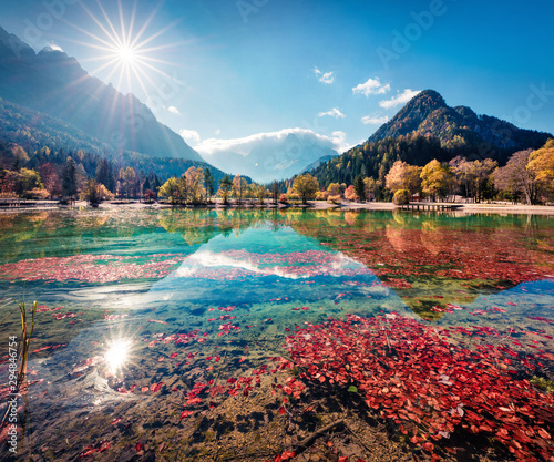 Gorgeous morning view of Jasna lake. Stunning autumn scene of Julian Alps, Gozd Martuljek location, Slovenia, Europe. Wonderful landscape of Triglav National Park. Traveling concept background.
