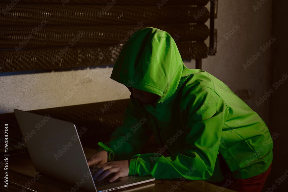 Young Female Hacker Breaks into Corporate Data Servers from His Underground Hideout. Place Has Dark Atmosphere - Image Young Female Hacker Breaks into Corporate Data Servers from His Underground Hideout. Place Has Dark Atmosphere - Image