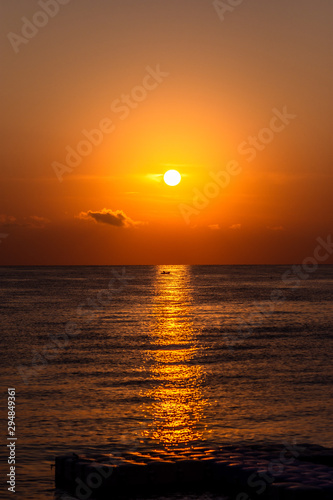 Fototapeta Naklejka Na Ścianę i Meble -  Summer sea sunset in Greece. Fisherman in boat.