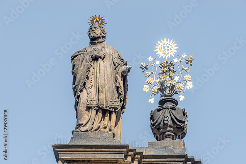 Decorative facade statues of priests and bishops at Saint Salvator church near Charles Bridge in Prague  Czech Republic  summer time  details