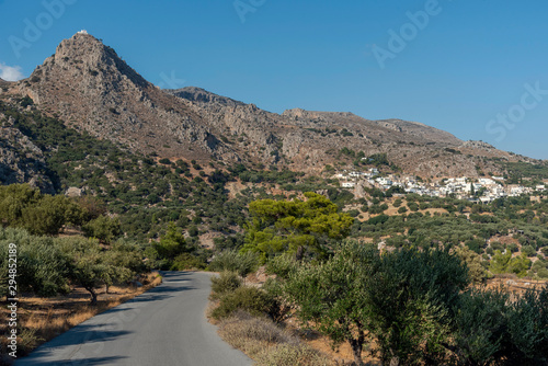 Mountain village of  Pefki seen from Agios Stefanos road, Crete, Greece. September 2019.  The mountainside ancient village of Agios Stefanos one of the oldest in Crete.