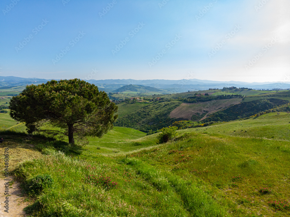 Fototapeta premium Tuscany countryside hills, stunning aerial view in spring.