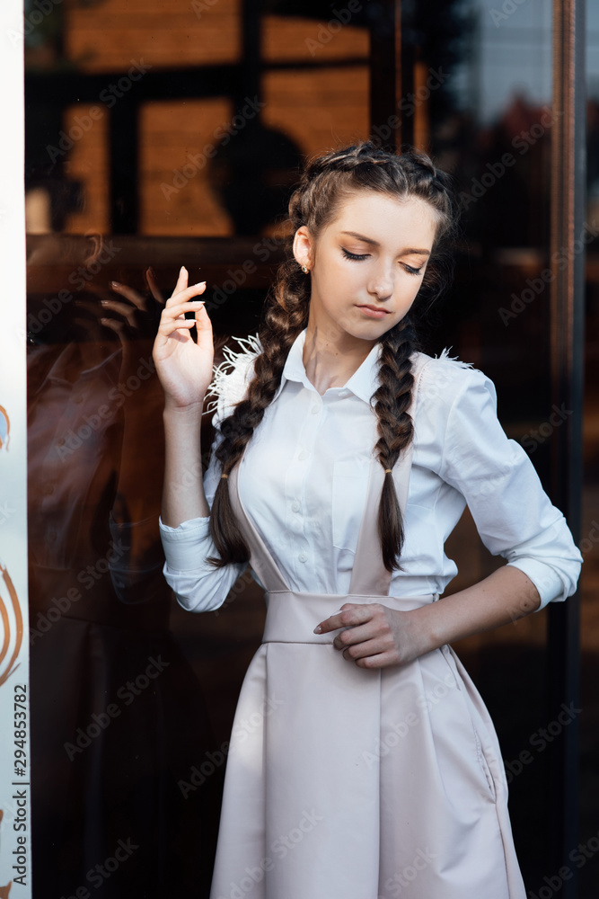 Pretty teen girl wearing school uniform. Education. Teenager student girl.  Beautiful girl with professional make up and hairstyle. Female fashion  Stock Photo | Adobe Stock