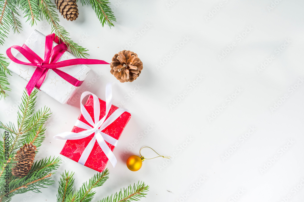 Christmas greeting card background with fir tree and decoration, white table background flat lay top view copy space