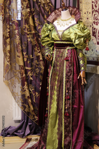 Vintage details of an antique dress on a tailor's mannequin. Women's fashion and luxurious retro clothing. Elegant style