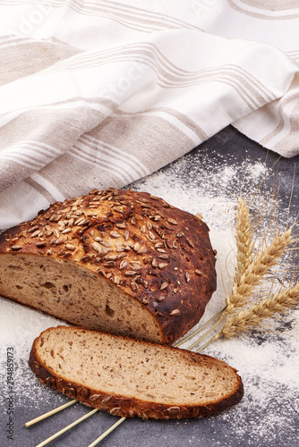 Traditional round rye bread on a rustic background