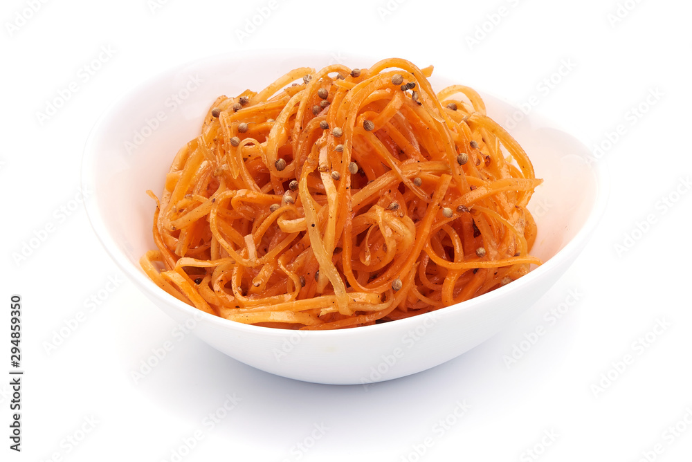 Gratted raw carrots in korean-style, korean carrot in the white bowl, isolated on white background Gratted raw carrots in korean-style, korean carrot in the white bowl, isolated on white background