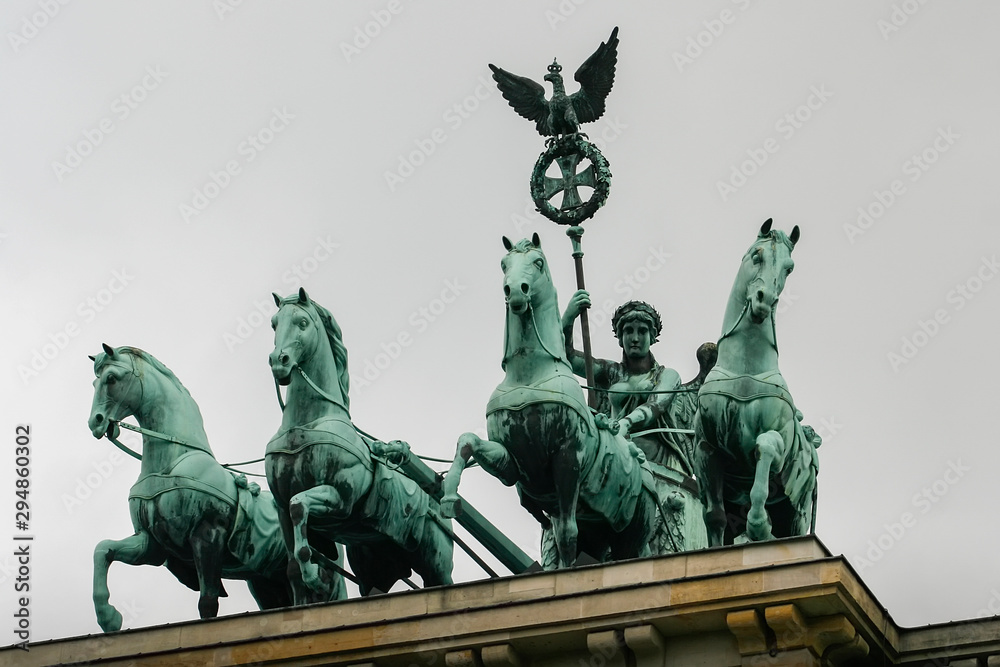 Fototapeta premium Bronze Quadriga chariot on top of the Brandenburg Gate Tor in Berlin, Germany.